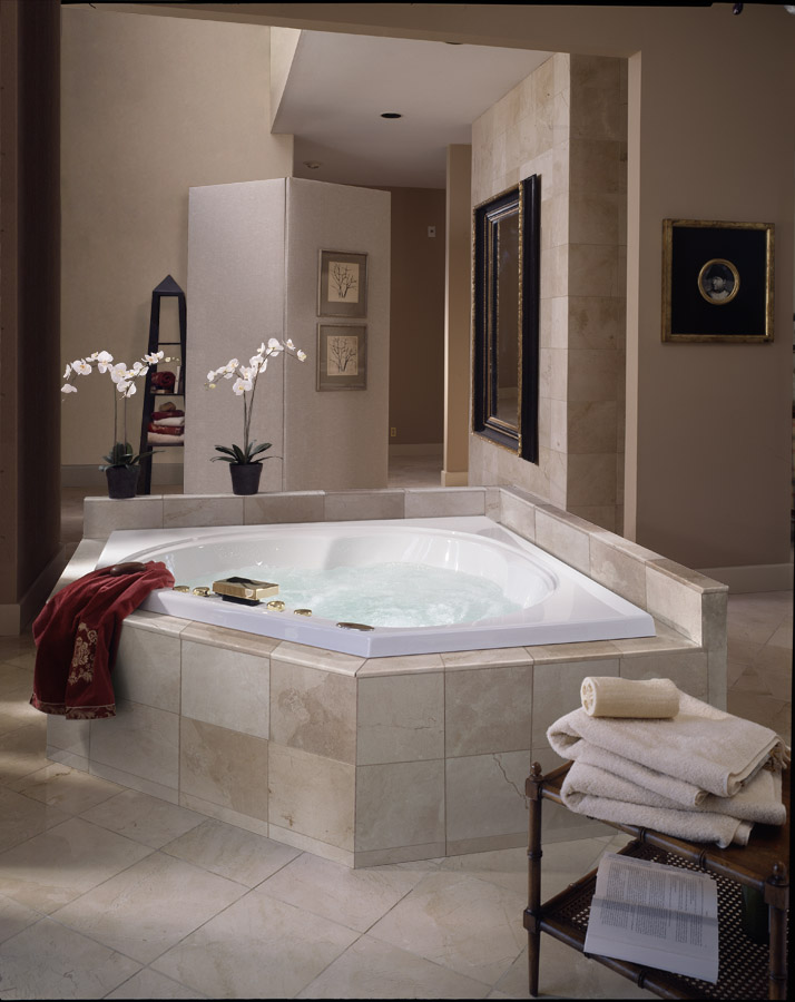 After: staircase removed, stone tile tub surround