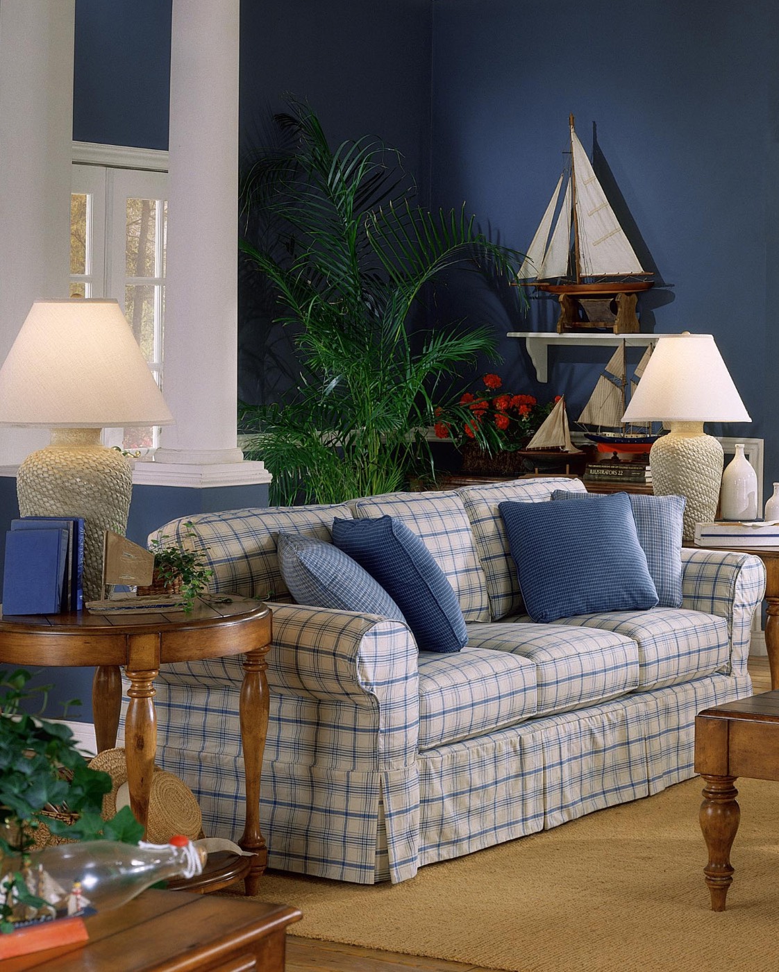 Before: sofa in blue plaid against blue walls